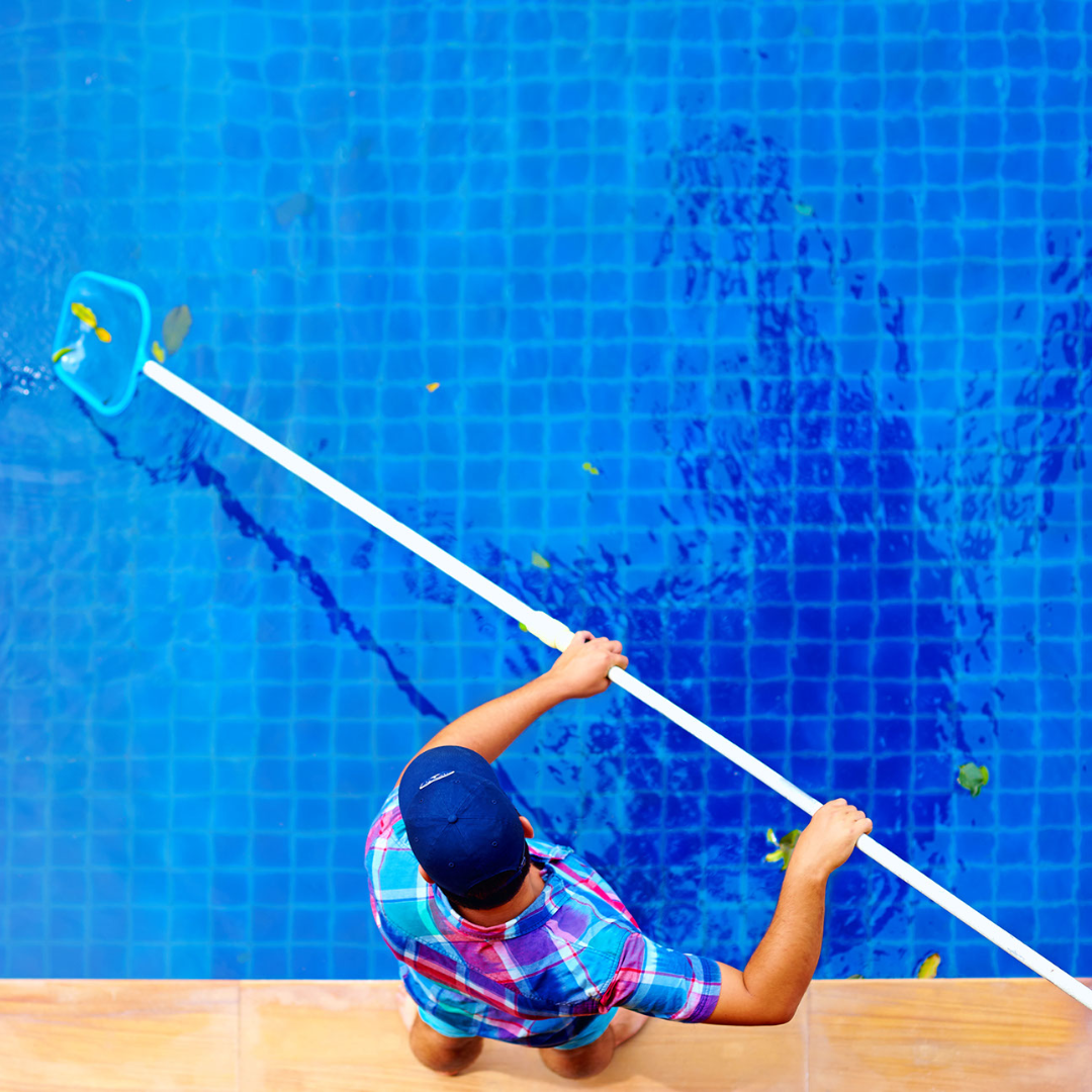 Professional technician from Ph.D. Pool Care performing pool repair in Bastrop, Texas, focusing on a cracked pool tile.