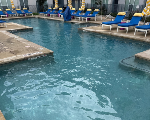 Safe and effective chemical treatment for swimming pools being conducted by a Ph.D. Pool Care specialist in Bastrop, Texas.
